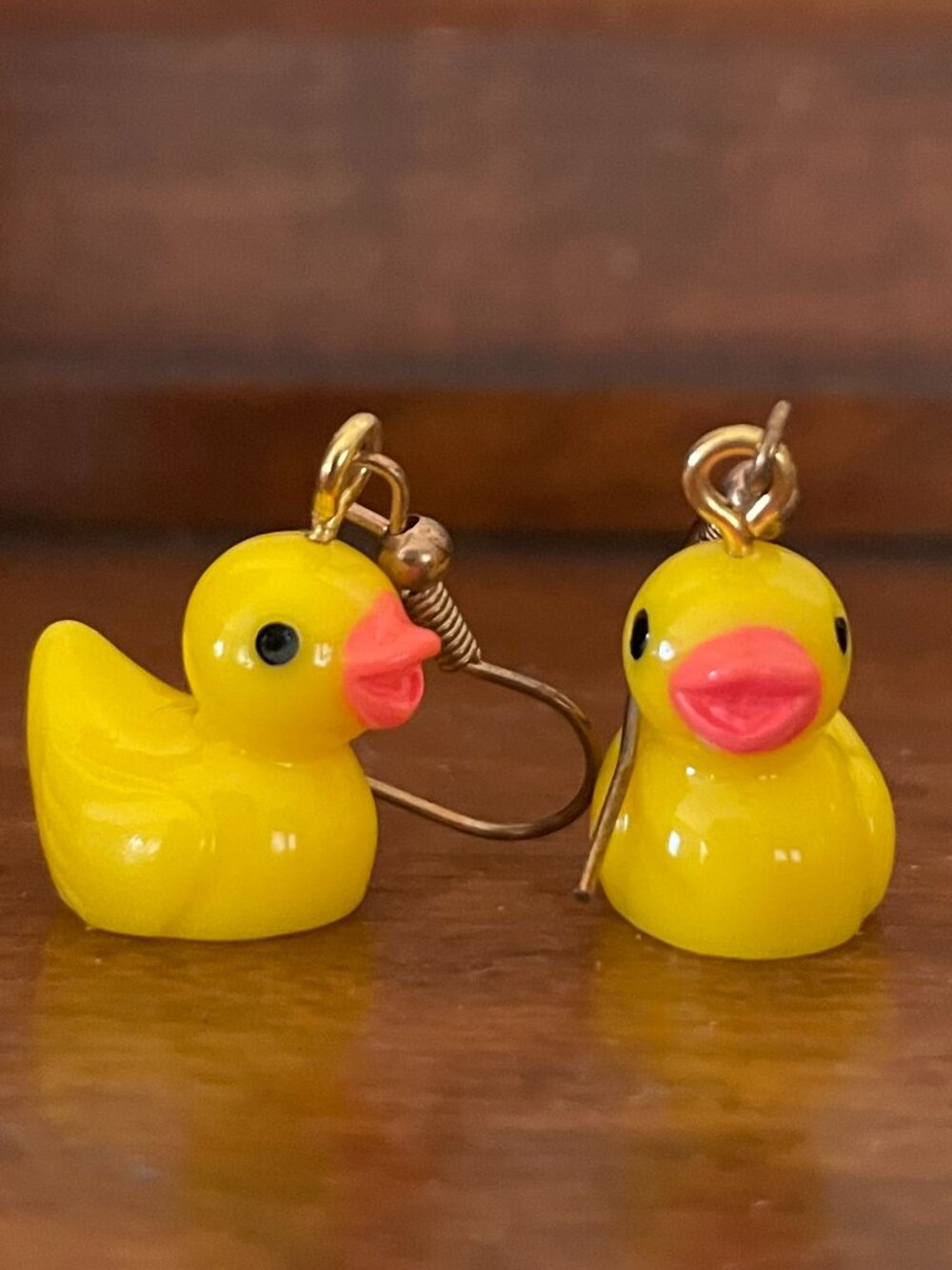 Bundle 3/$12.  Pair of plastic duck dangle earrings